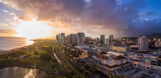 Sun set over skyline of Honolulu stock photo