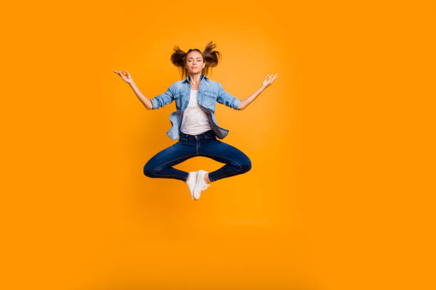 Full length body size view of nice attractive lovely slim sporty Full length body size view of nice attractive lovely slim sporty sportive fit candid calm school girl meditating chakra having fun isolated over bright vivid shine yellow background teen yoga stock pictures, royalty-free photos & images