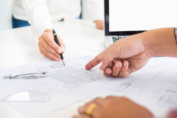 istock High Angle View Of Architects Working At Desk 1125897525