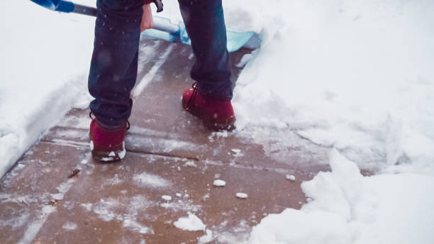 istock Young man shoveling snow from driveway. 1125899559