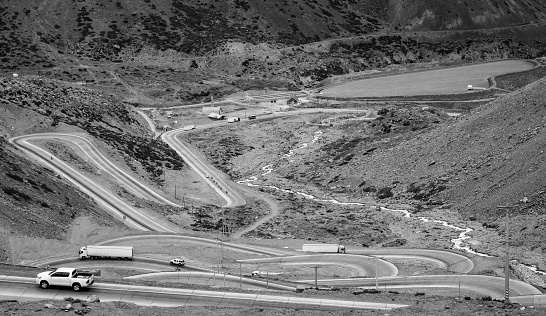 Black and white birds eye photo of the road through the Andes from Chile to Argentina