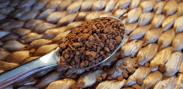 istock Spoon with instant coffee on placemat. 1125901735
