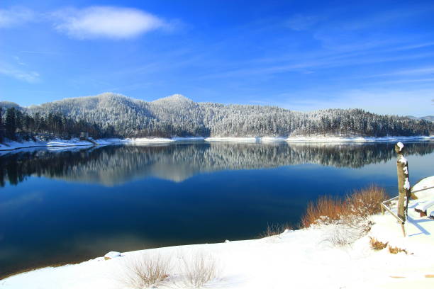 Lake and forest in winter; Gorski kotar area, Croatia stock photo