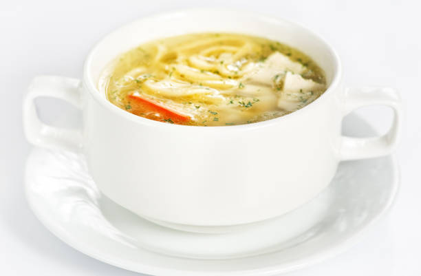 istock Bowl with chicken soup on white 1125903602
