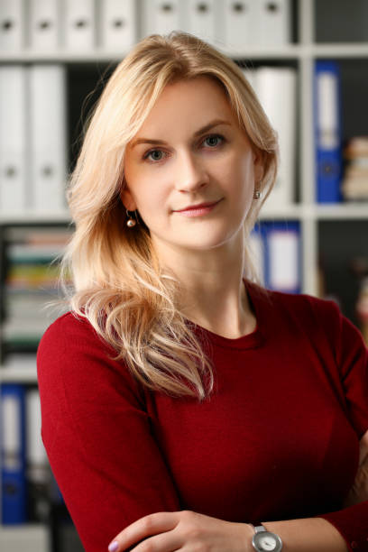 istock Normal blond woman portrait at office 1125903604