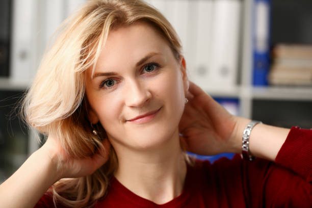 istock Normal blond woman portrait at office 1125903609