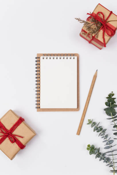 istock Mock up workspace empty clipboard with eucalyptus and gift box on white background. Flat lay, top view. Image. 1125904944