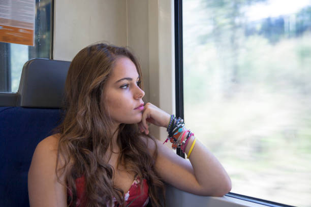 istock Happy girl traveling by train 1125906639