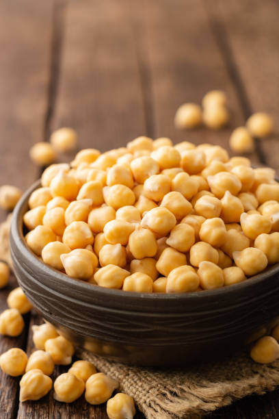 istock Chickpeas in ceramic bowl on dark wooden rustic table 1125908367