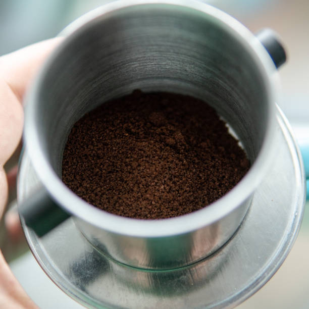 istock ground coffee in a tablespoon. Portion of coffee for cooking. 1125909876