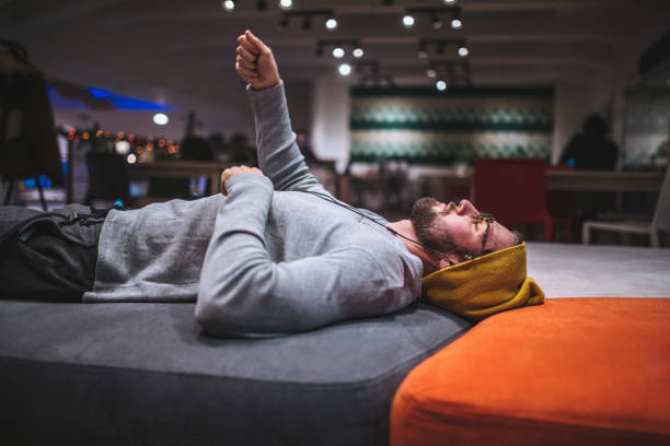 Handsome and successful young freelancer working in a coworking space in city center during winter.