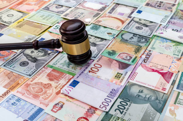 istock Judge hummer on various banknotes background close up 1125910867