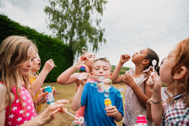 istock Blowing Bubbles in the Garden 1125911041