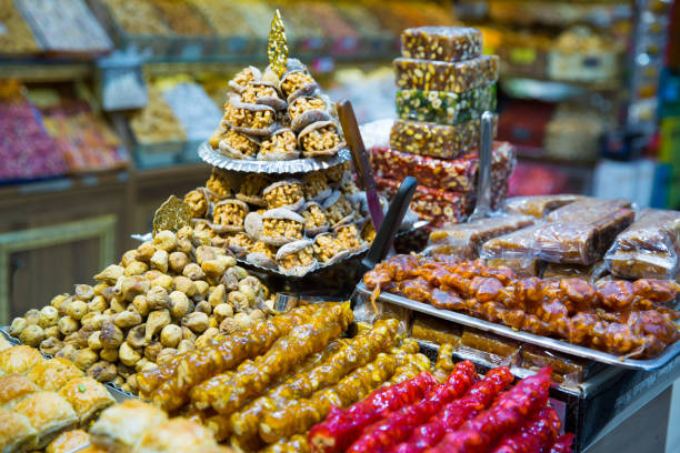 Turkish desser Baklava with pistachio, honey and walnut. Tasty turkish delights. Baklava with pistachio, honey and walnut. Tasty turkish delights. silver platter stock pictures, royalty-free photos & images