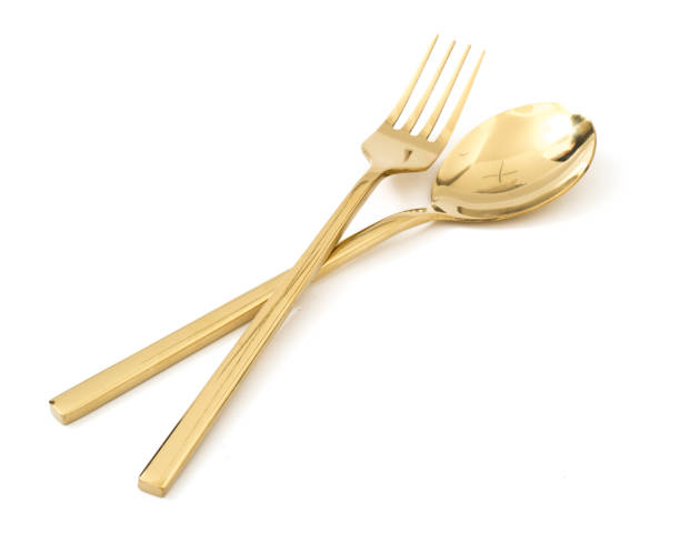 istock golden spoon and fork isolated on a white background 1125913014