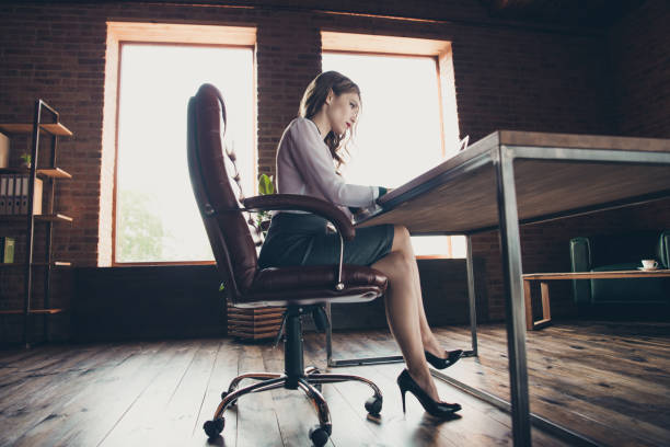 istock Low below angle profile side view of nice trendy attractive charming focused wavy-haired lady partner attorney lawyer agent broker at work place station 1125913030