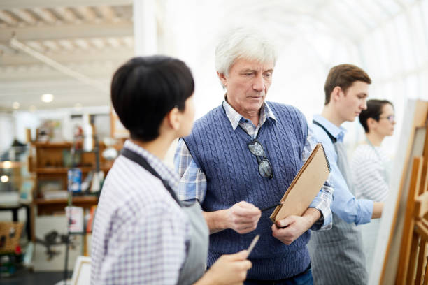 istock Mature Art Teacher in Studio 1125914635