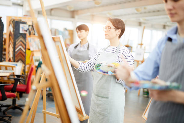 istock Row of Artists in Sunlit Studio 1125914650