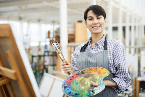 istock Young Female Artist Holding Palette 1125914659