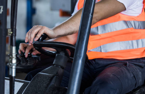istock Close up of manual worker driving a forklift. 1125916856