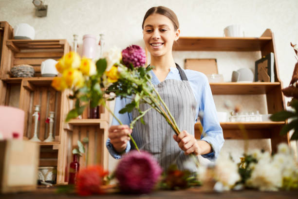 istock Florist Arranging Flowers 1125917139