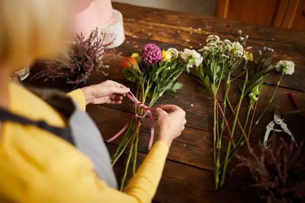 Photo of Florist Making Bouquet Close up