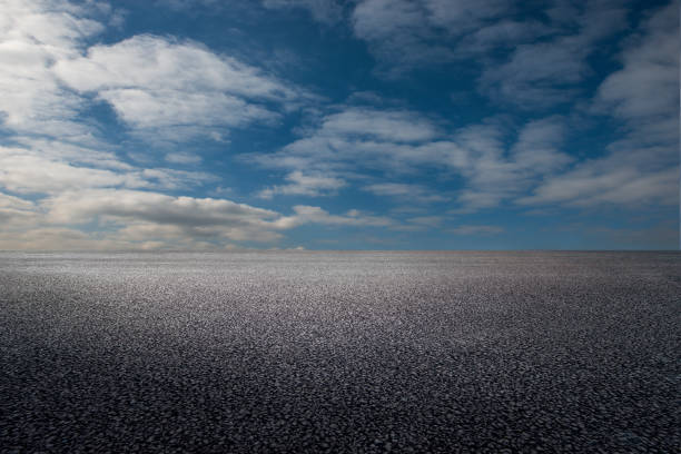 istock Asphalt road and sky clouds background 1125917586
