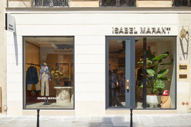 isabel marant store with golden letters sign in paris in a sunny day - lifestyles designer store luxury imagens e fotografias de stock