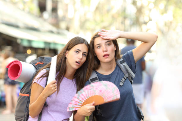 Two backpackers suffering heat stroke on vacation
