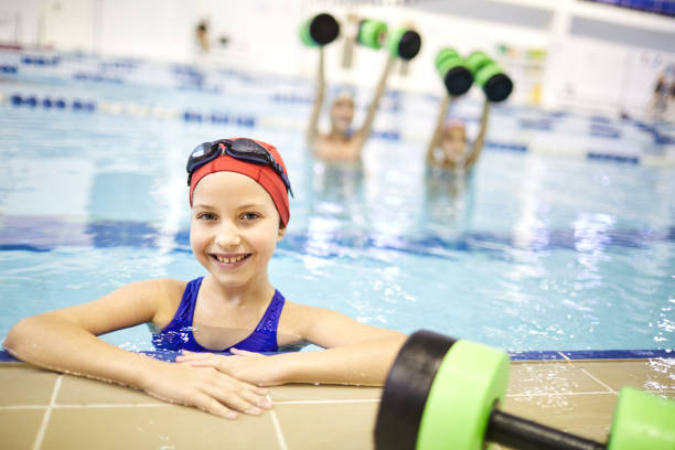 istock Little girl training in the pool 1125923791