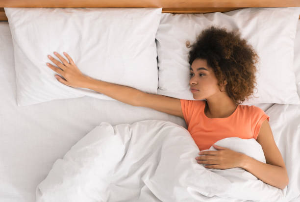 istock Lonely woman missing her partner, waking up in the morning 1125924700