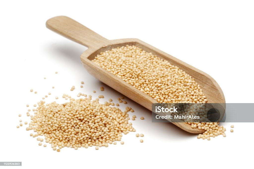 Amaranth seeds with wooden spoon Amaranth seeds with wooden spoon isolated on white background Quinoa Stock Photo