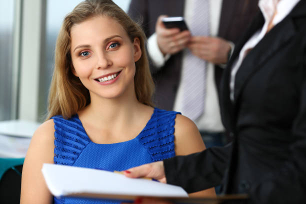 istock Group of modern businesspeople in office 1125926474