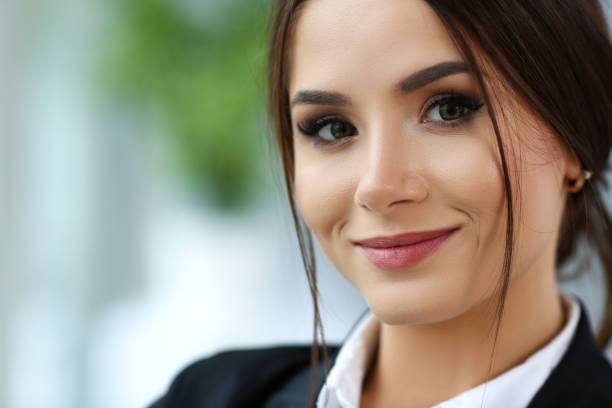 istock Beautiful smiling clerk girl wearing suit hold notebook 1125926504