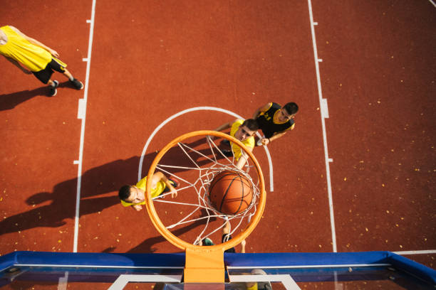 istock Drone point view of basketball hoop during game 1125927632