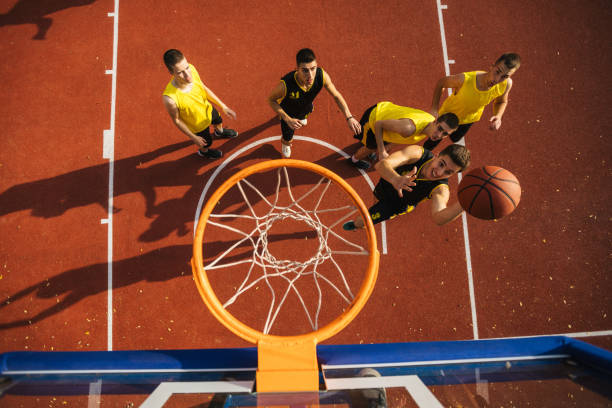 istock Drone point view of basketball hoop during game 1125927671