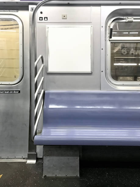 Subway seats and blank billboard Subway seats and blank billboard in New York railroad car photos stock pictures, royalty-free photos & images