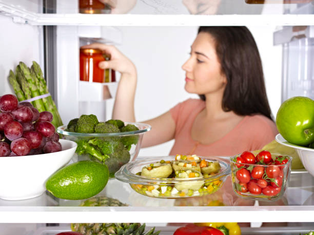 istock Woman taking a jar from a fridge 1125934326