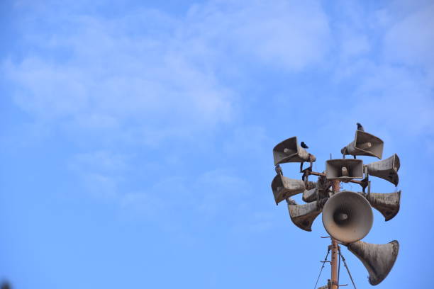 A speaker against a blue sky stock photo