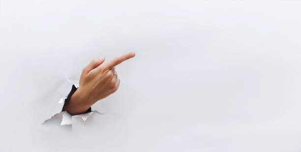istock The forefinger points to the right side. White background. Index Finger. Place for advertising. Copy space. 1125935704