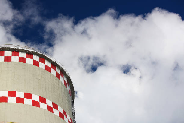 istock White smoke comes from pipes against blue sky 1125938987