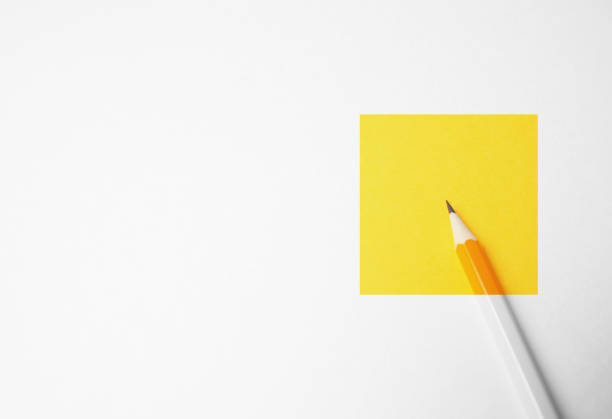 istock Yellow pencil on a white background, minimalism. Abstract art, imagination, education 1125939743