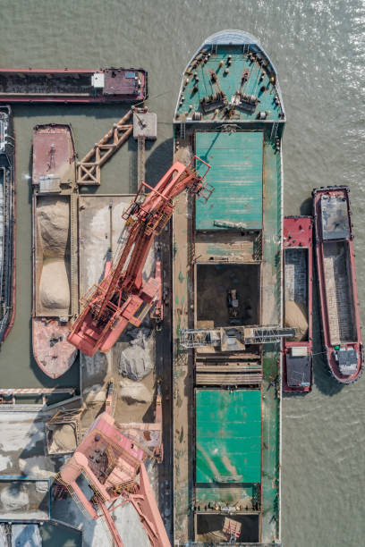 istock Cargo industrial port, port cranes. Loading of sand mine 1125941406