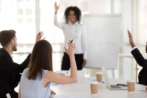 istock Diverse group of business people voting at meeting 1125941780