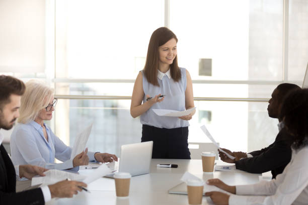 istock Multi-ethnic business people sitting at desk during briefing 1125941795