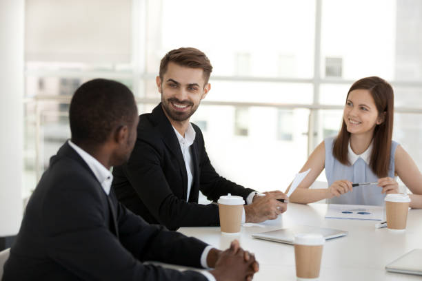 istock Diverse coworkers chatting during break sitting in conference room 1125941825