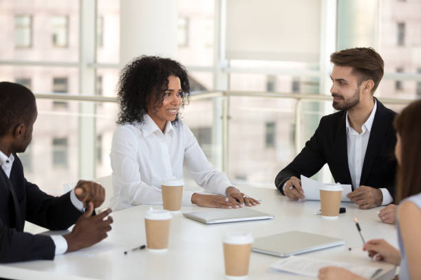 istock Diverse workers and coach during briefing in modern office 1125941827