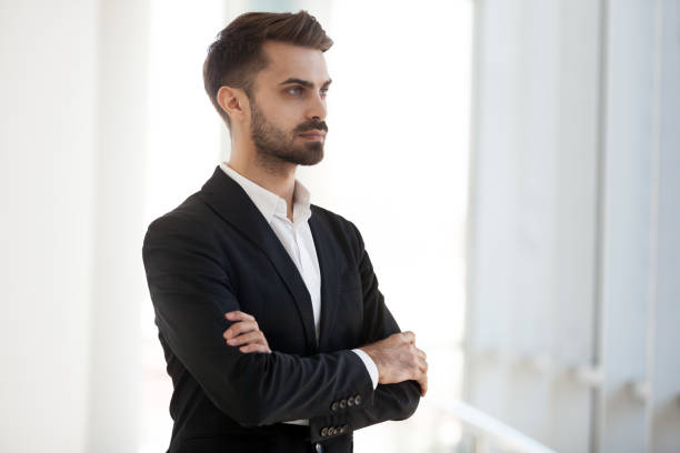 istock Confident serious company owner thinking looking away 1125941879