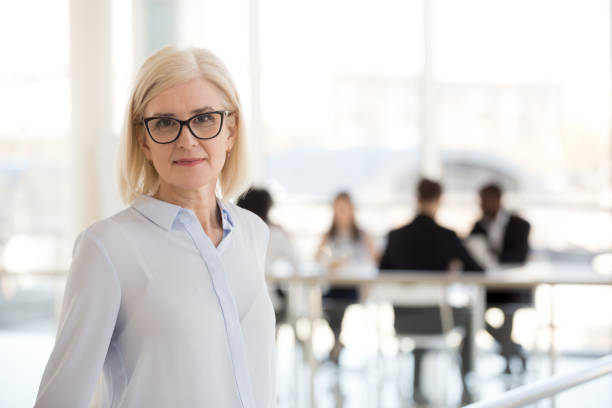 istock Aged confident team leader company founder standing looking at camera 1125941887
