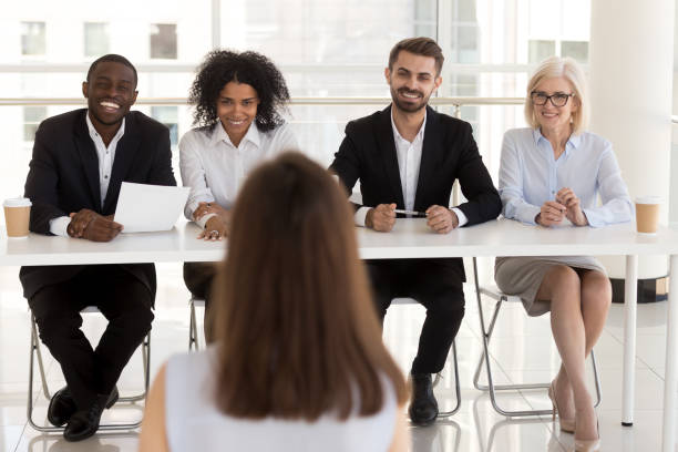 istock Group of positive diverse people interviewing vacancy applicant 1125942529